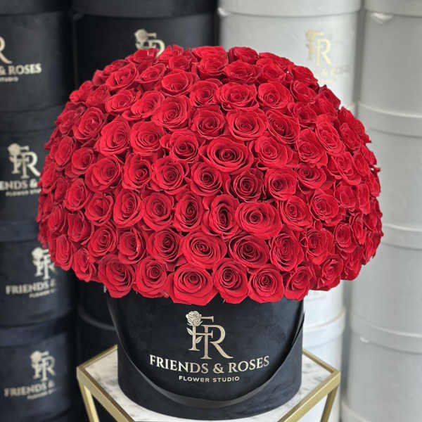 Large dome of red roses in a black hat box