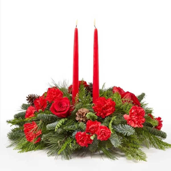 Red floral centerpiece with two tall red candles