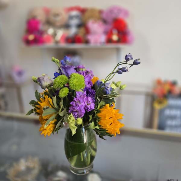Colorful mixed bouquet in a clear glass vase