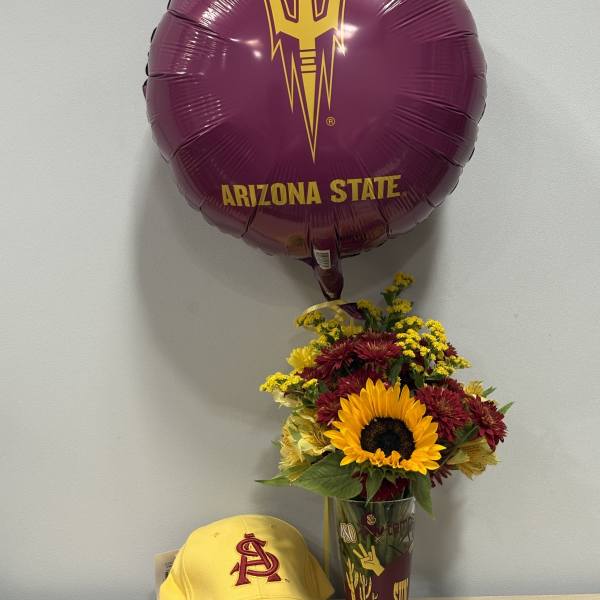 Sunflower bouquet in a glass vase with an Arizona State balloon and yellow cap