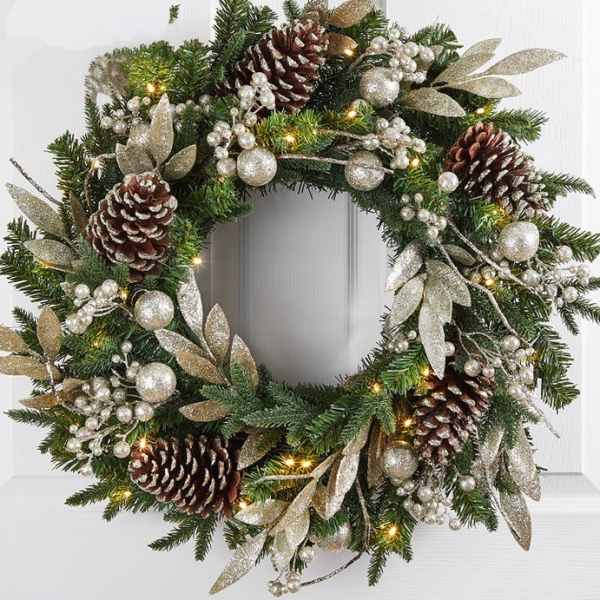Christmas wreath with pinecones, silver ornaments, and glittered leaves