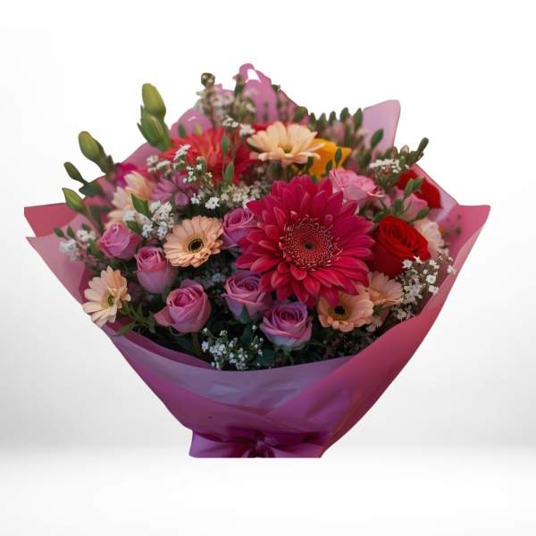 Bouquet of pink, red, and peach flowers wrapped in magenta paper