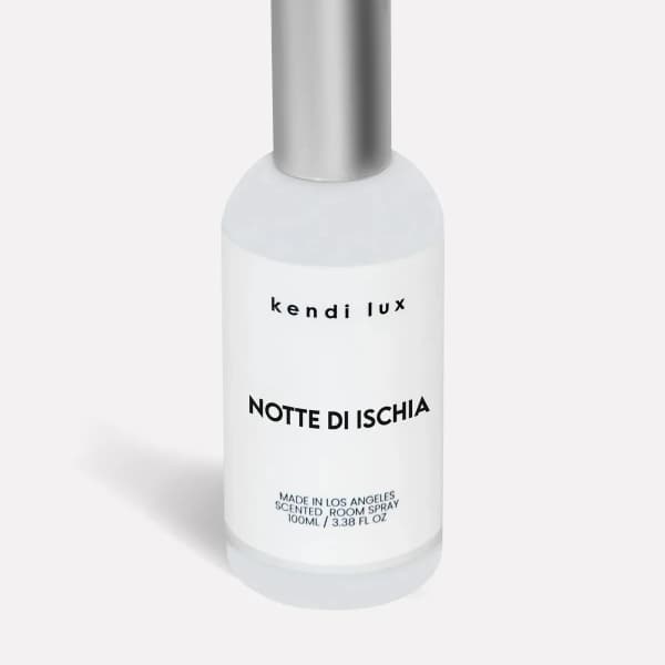 Bottle of scented room spray with a silver cap