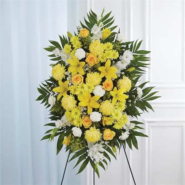 Yellow and white floral standing spray on an easel