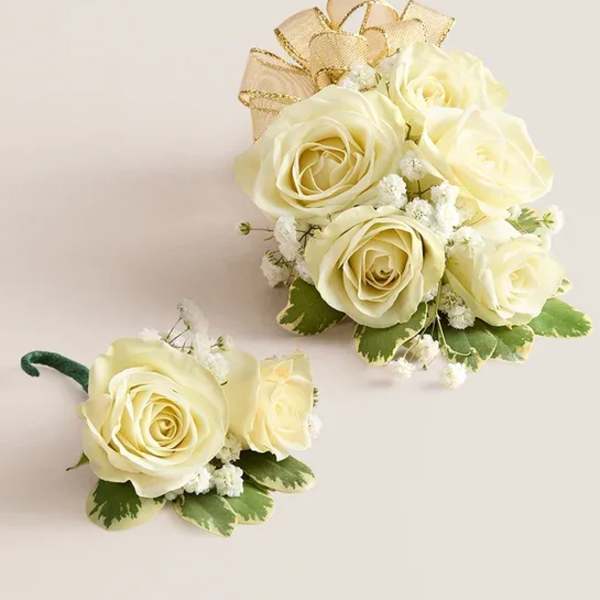 Cream rose boutonniere and matching wrist corsage with gold ribbon