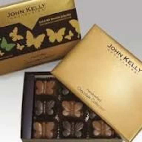 Gold box of butterfly-shaped assorted chocolates with branded lid