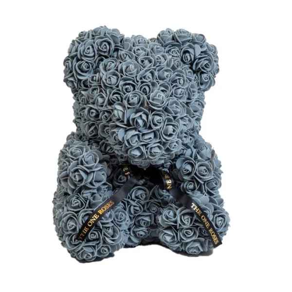 Gray teddy bear made of small roses with black ribbons