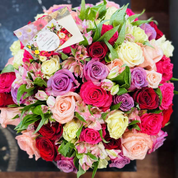Mixed bouquet of roses and alstroemeria in pink, red, and lavender
