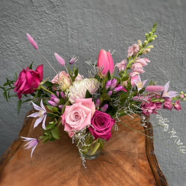 Pink and lavender bouquet in a clear glass vase
