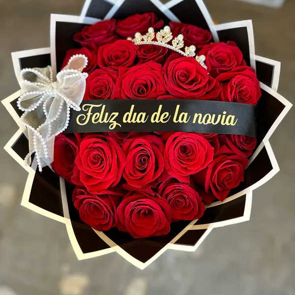 Bouquet of red roses with a tiara and ribbon banner