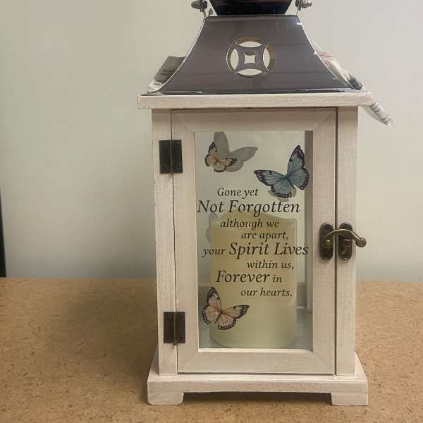 Decorative memorial lantern with butterflies and a sympathy message
