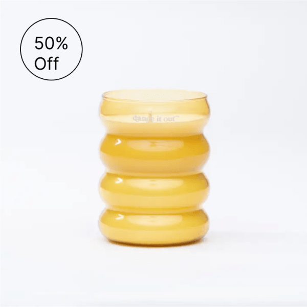 Yellow ribbed glass candle holder with a 50% off badge