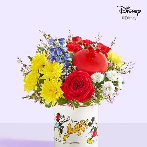 Colorful flower arrangement in a Mickey Mouse vase