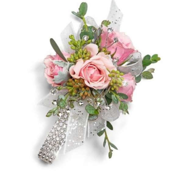 Pink rose corsage with silver ribbon and rhinestone accents