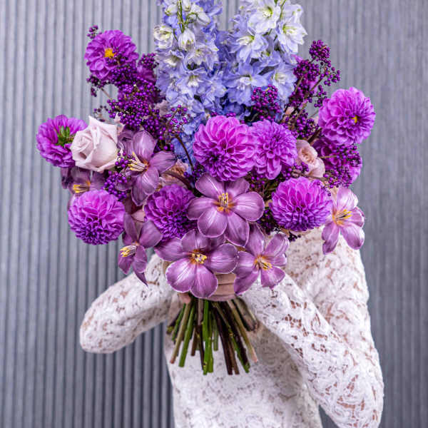 Purple and lavender bouquet with tall blue flower spikes