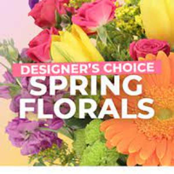 Colorful spring bouquet with roses, gerbera daisies, and mixed blooms