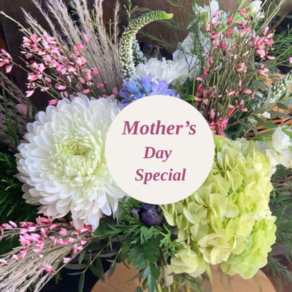 Mixed bouquet with white chrysanthemums, green hydrangea, and pink accents