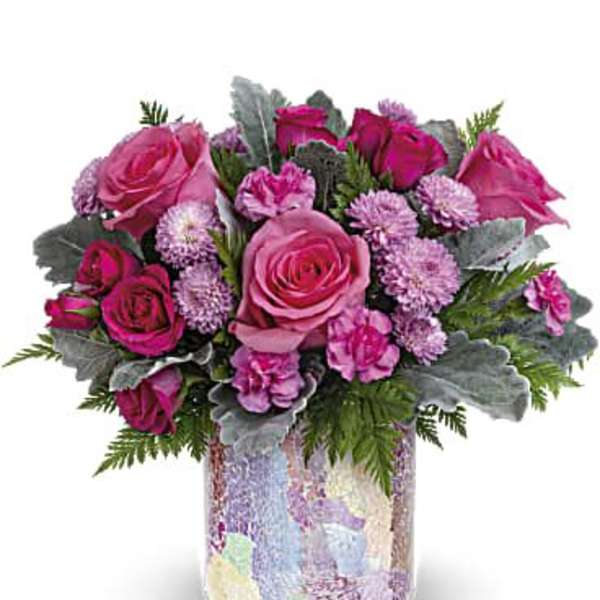 Pink roses and carnations in a patterned vase