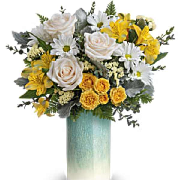 Tall vase of white roses, daisies, and yellow flowers in a blue ombré cylinder
