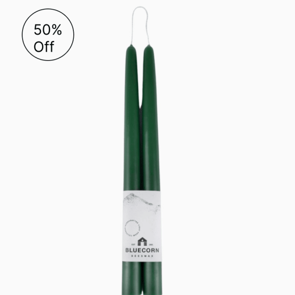 Pair of dark green taper candles bound together with a white Bluecorn Beeswax label