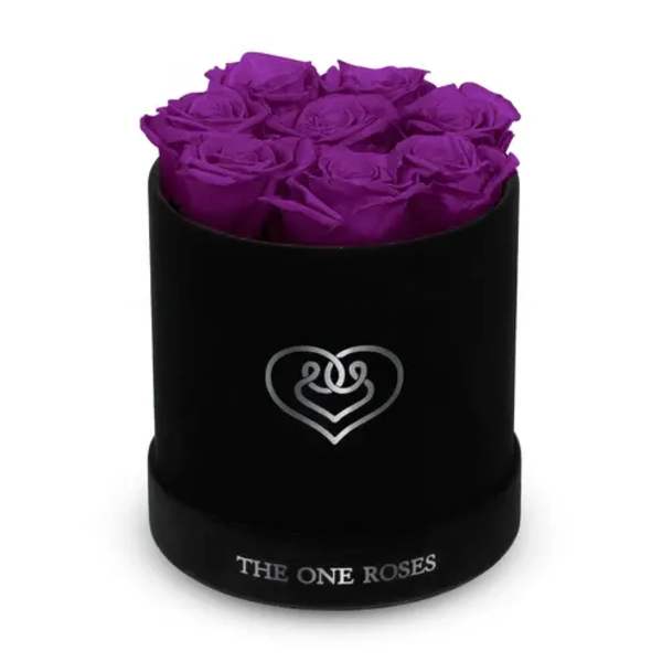 Purple roses arranged in a black cylindrical box