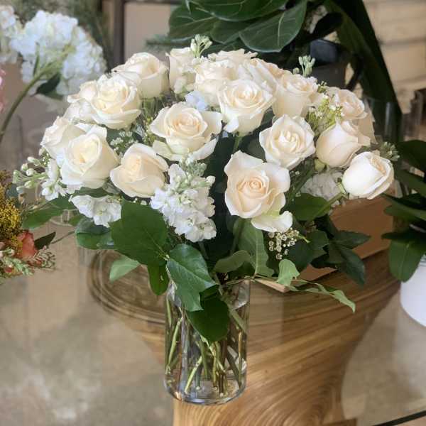 Bouquet of white roses in a clear glass vase