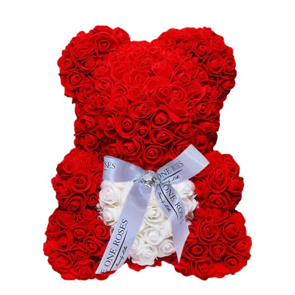 Red rose teddy bear with a white ribbon bow