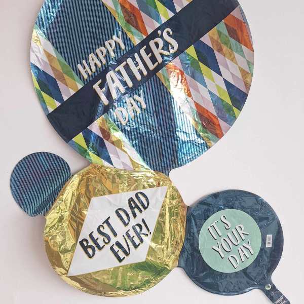 Three Father’s Day balloons with bold printed messages