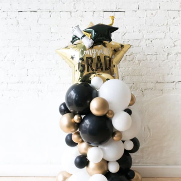 Graduation balloon arrangement with a star-shaped "Congrats Grad" balloon