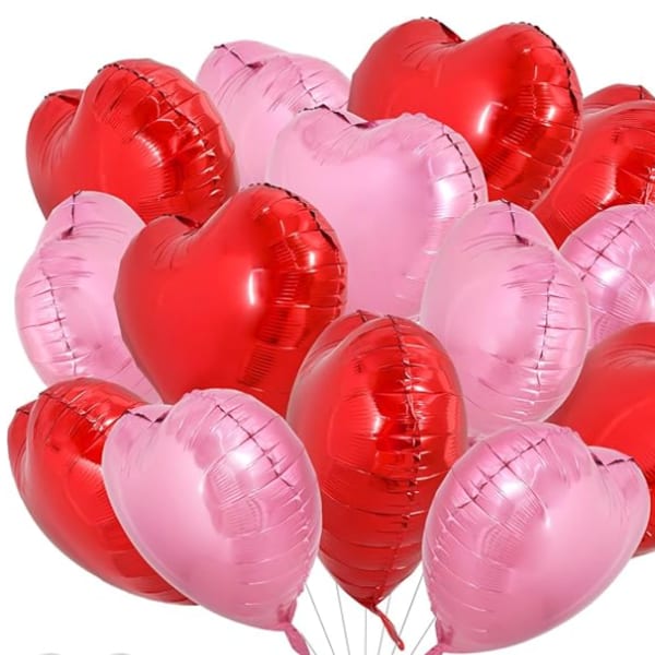 Cluster of red and pink heart-shaped balloons