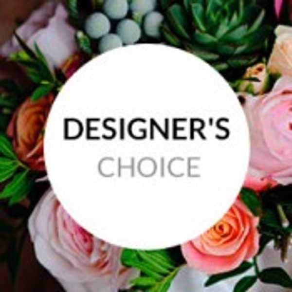 Designer’s choice floral arrangement with pink and peach roses