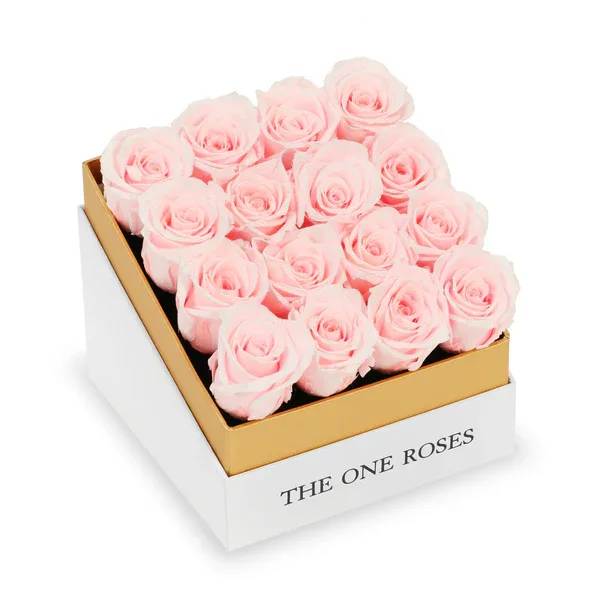Box of pale pink roses in a white and gold gift box
