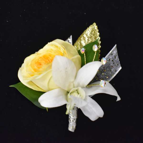 Yellow rose and white orchid boutonniere with glittery ribbon accents