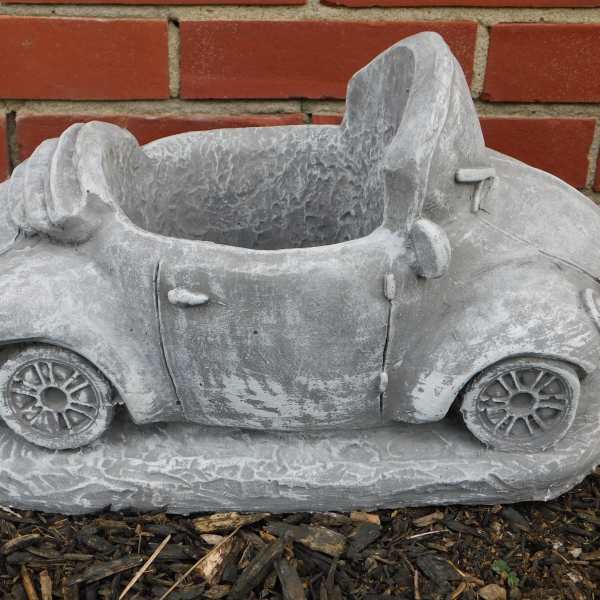 Gray concrete planter shaped like a small car