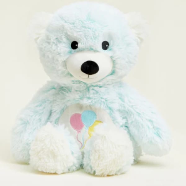Light blue teddy bear plush with a balloon graphic on its chest