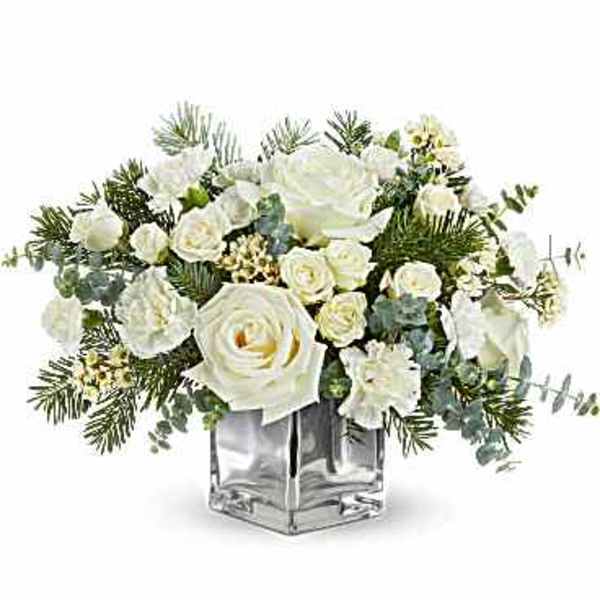 White rose arrangement in a clear square vase