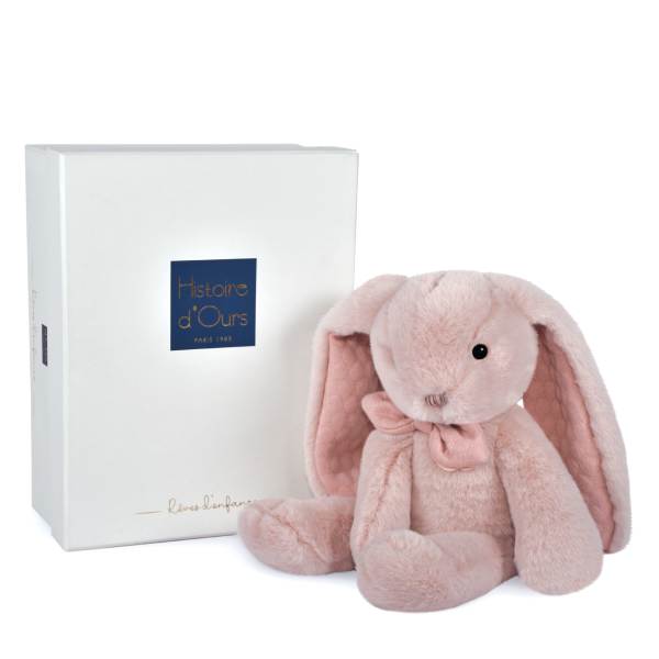 Pink plush bunny with a ribbon beside a white gift box