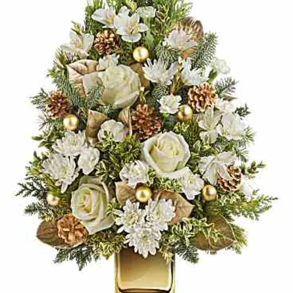 White flowers and pinecones arranged in a gold glass vase