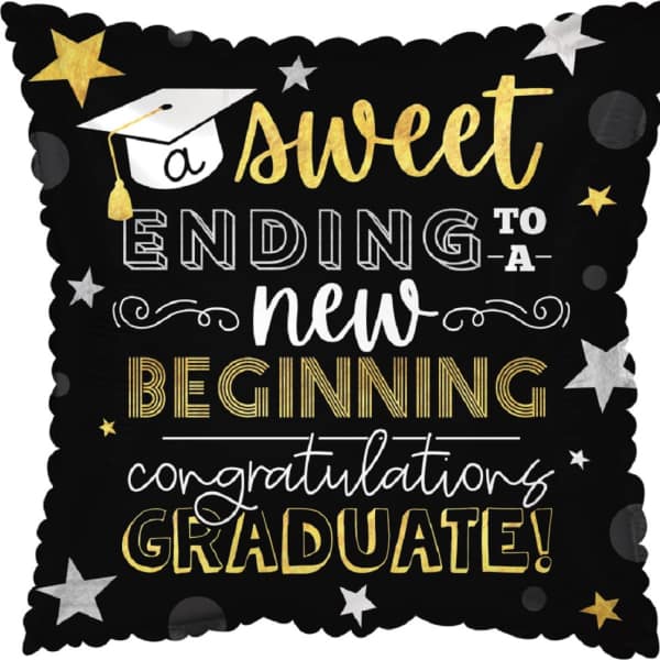 Graduation-themed decorative pillow with gold and white text on black background