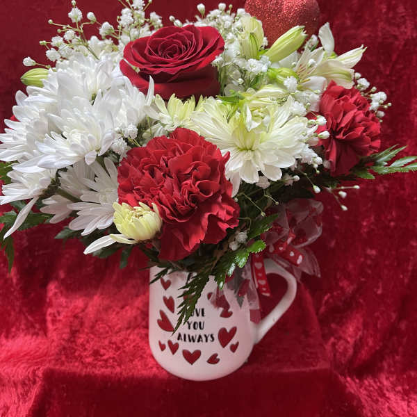 Red and white bouquet in a heart-decorated mug with glitter hearts