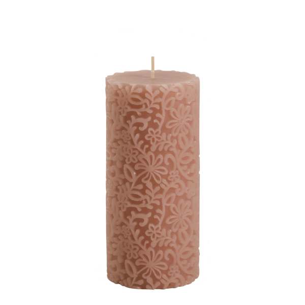 Pink decorative pillar candle with floral cutout pattern