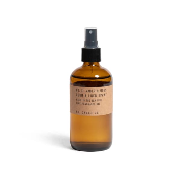 Amber room spray bottle with black pump top