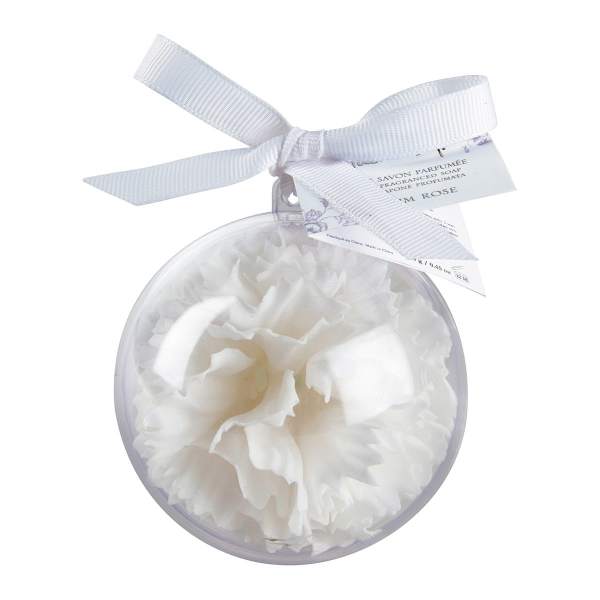 White flower-shaped soap in a clear round ornament with a ribbon bow