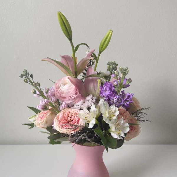 Pink and white mixed bouquet in a pink vase