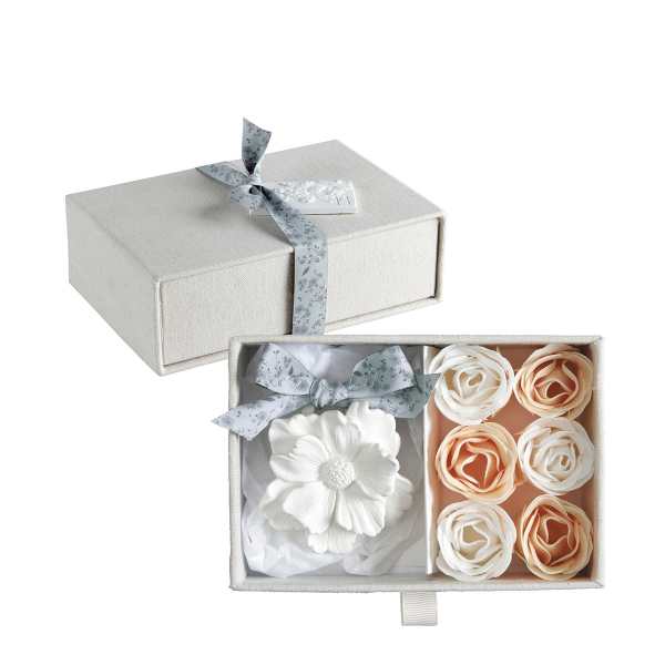 Gift box with silk flowers and ribbon-tied lid