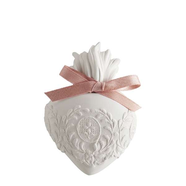 White decorative heart ornament with a pink ribbon bow