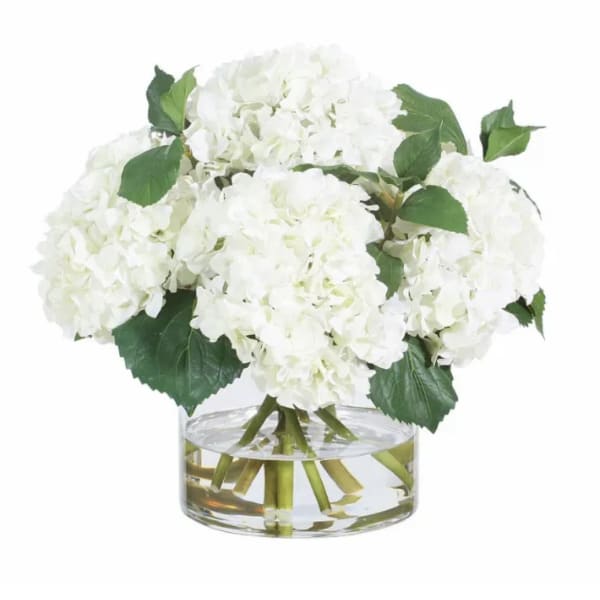 White hydrangea bouquet in a clear glass vase