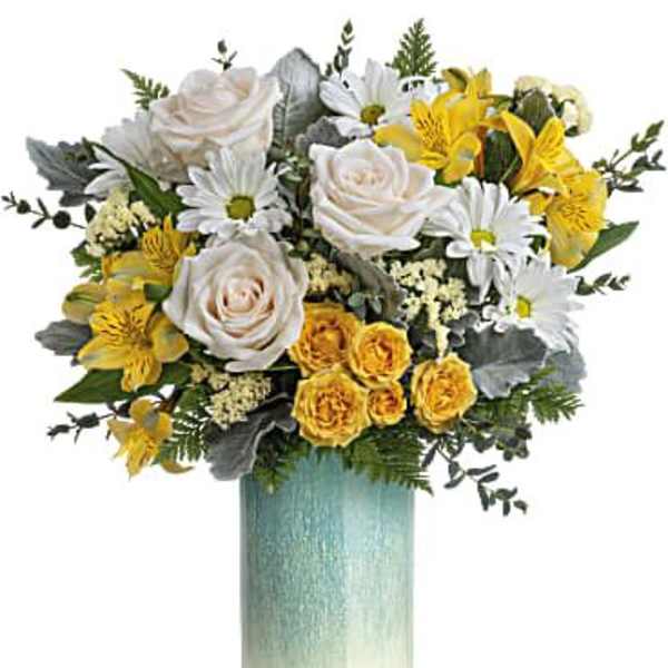 Bouquet of white and yellow flowers in a tall blue-green vase