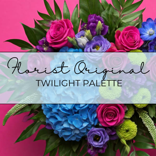 Bright mixed bouquet with pink roses, blue hydrangea, and purple flowers