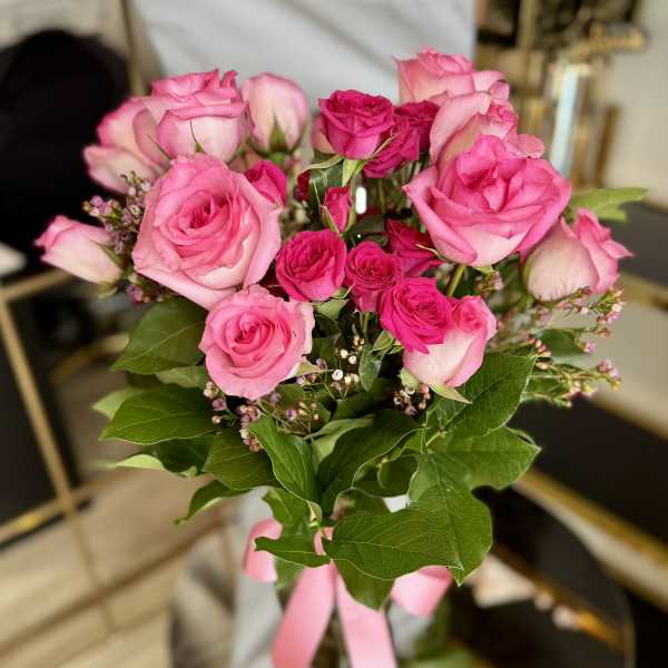 Bouquet of pink roses with a pink ribbon